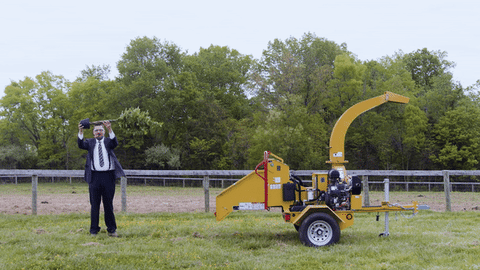 a person standing on top of a grass covered field