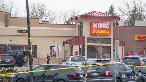 Boulder, Colorado USA - March 22, 2021: Police and SWAT officer in front of King Soopers - the scene of a mass shooting; Shutterstock ID 1941388633