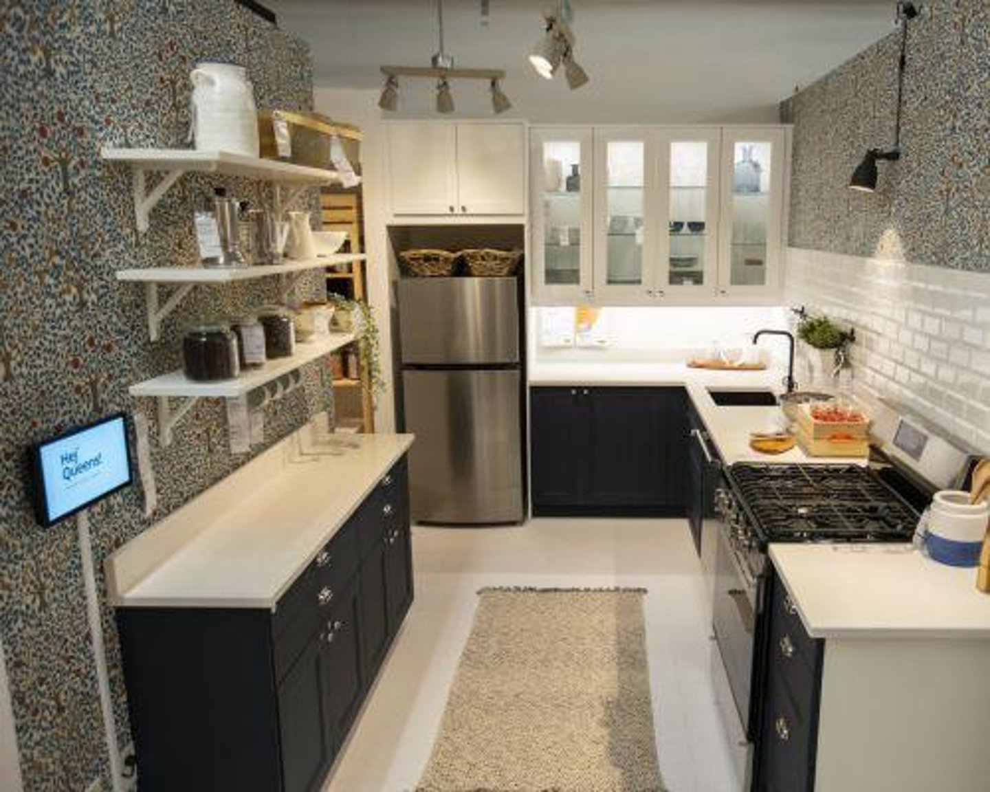 a kitchen with a stove a sink and a microwave