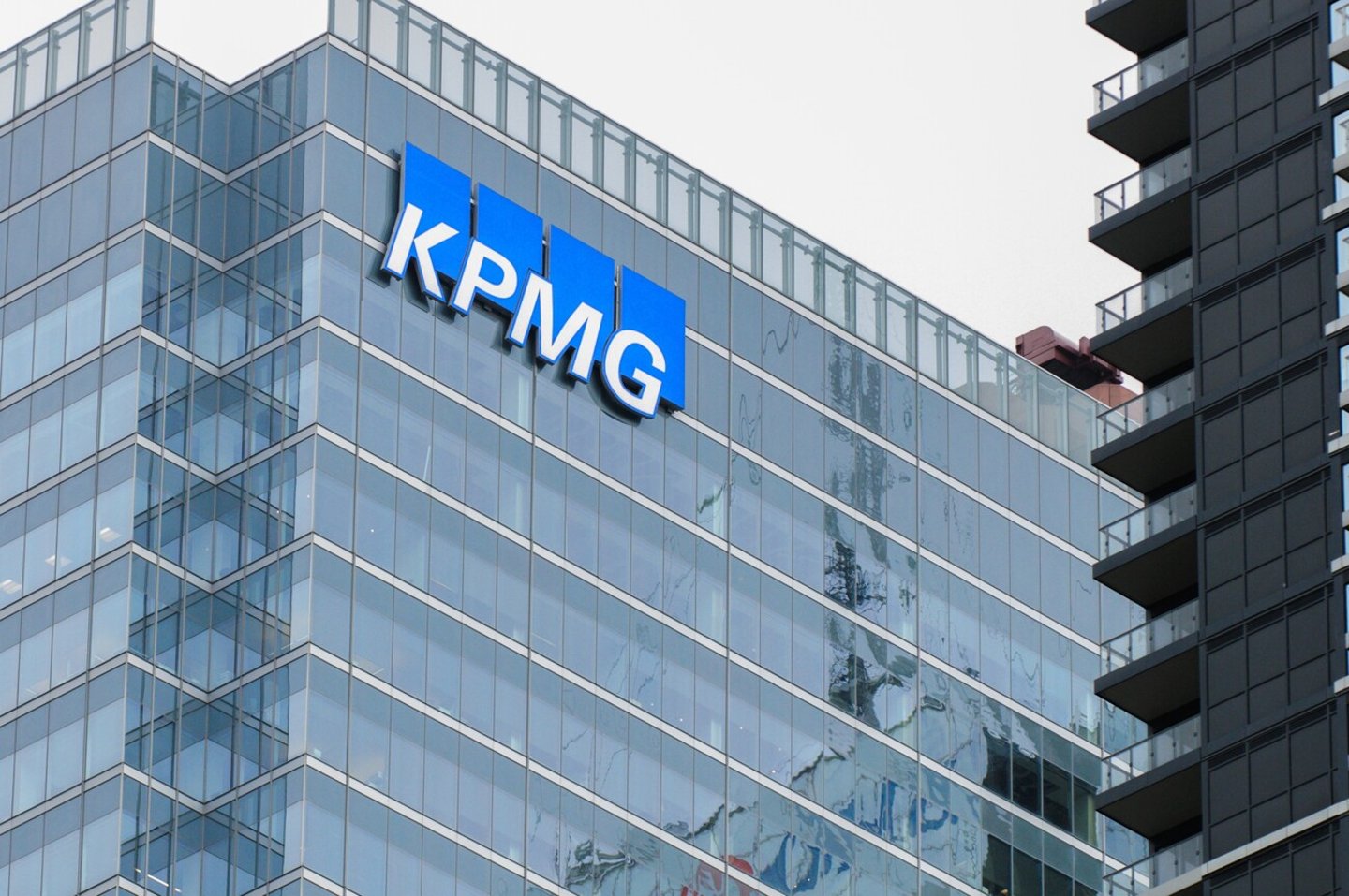 Toronto, ON, Canada -June 5, 2024: View at KPMG sign. KPMG is a multinational professional services network; Shutterstock ID 2497129275